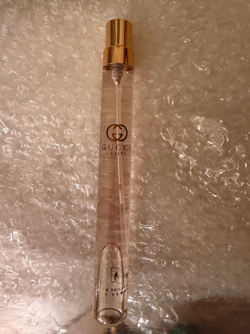 Gucci clear light pink spray with gold logo